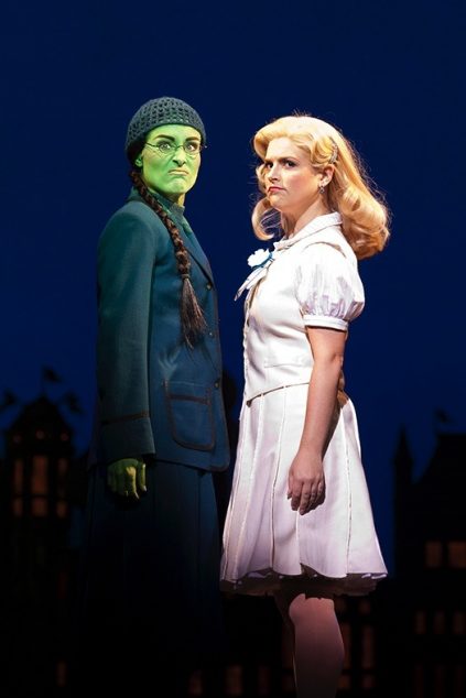 Jemma Rix as Elphaba and Lucy Durack as Glinda in WICKED. Image by Belinda Strodder