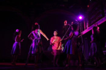 Ruthie Ann Miles (center) and the cast of Here Lies Love. Image by Joan Marcus